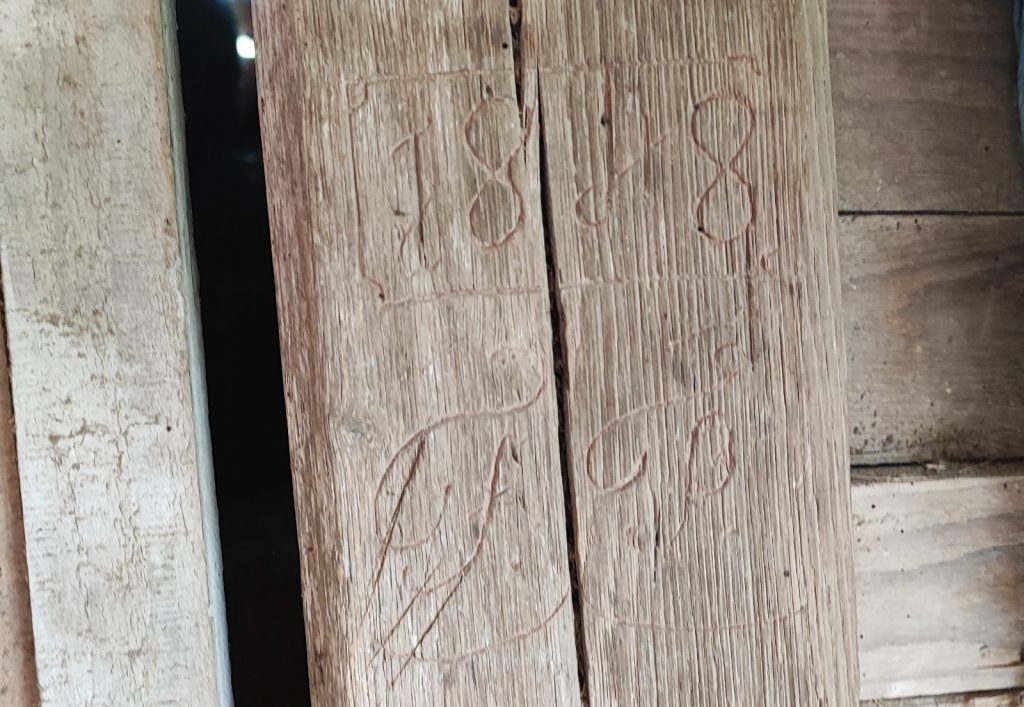 Engraved initials »1848 F.P.« of France Pustar (Korelc), carved in stone at the Pustar homestead in Stična, Slovenia – a unique trace of our shared ancestor.